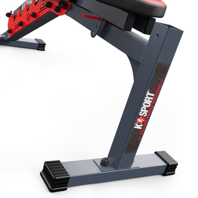 An exercise bench with a set of barbells and weights