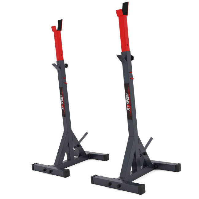 An exercise bench with a set of barbells and weights